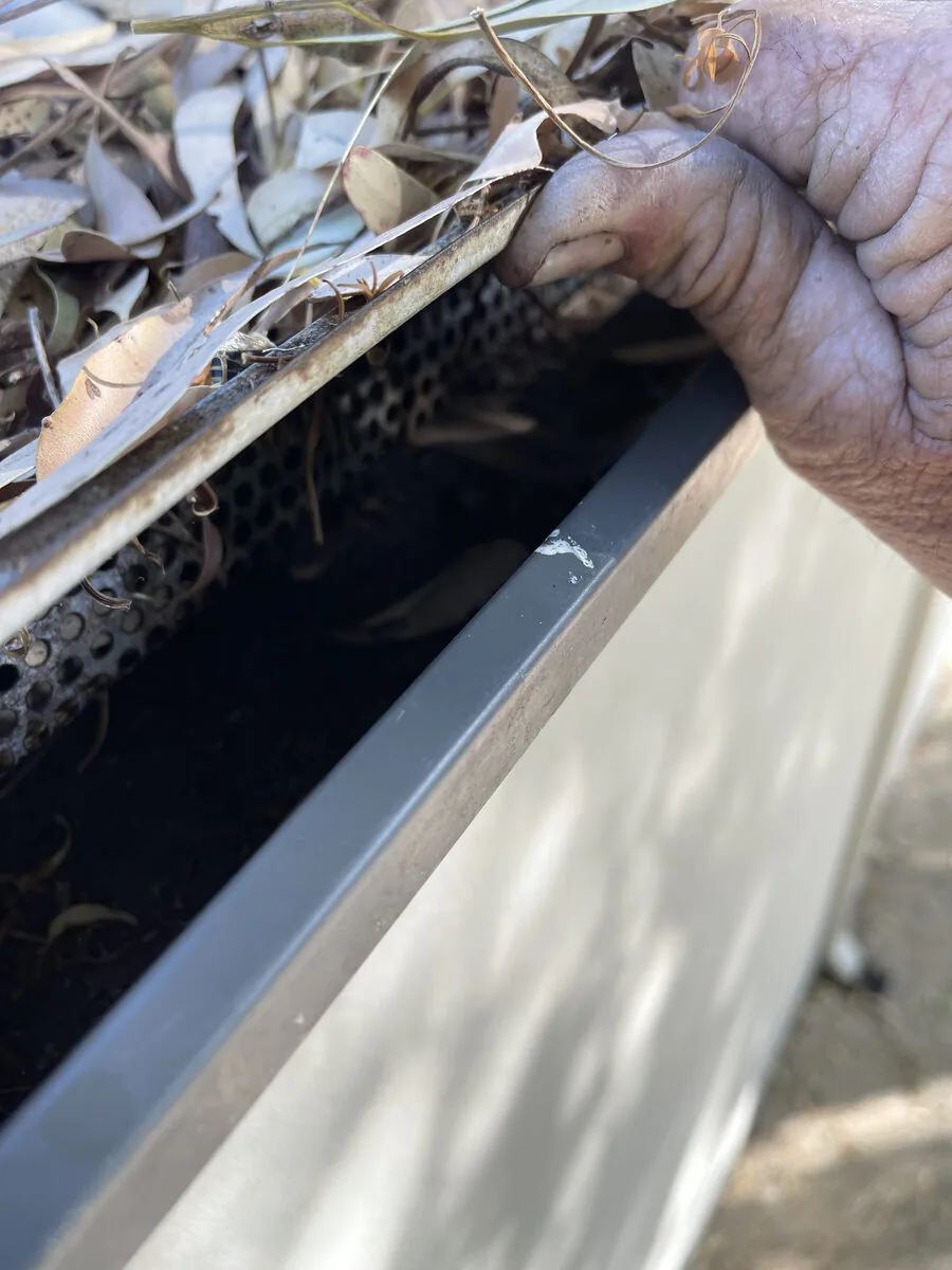 Severe rust and corrosion — metal corroded completely through under guard
