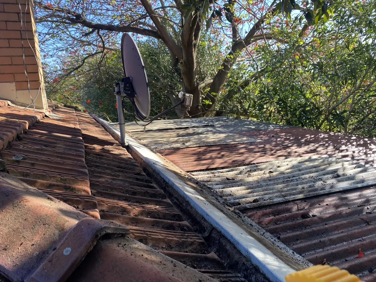The same tile-roof gutter fully cleared after ProFlo vacuum cleaning, Perth