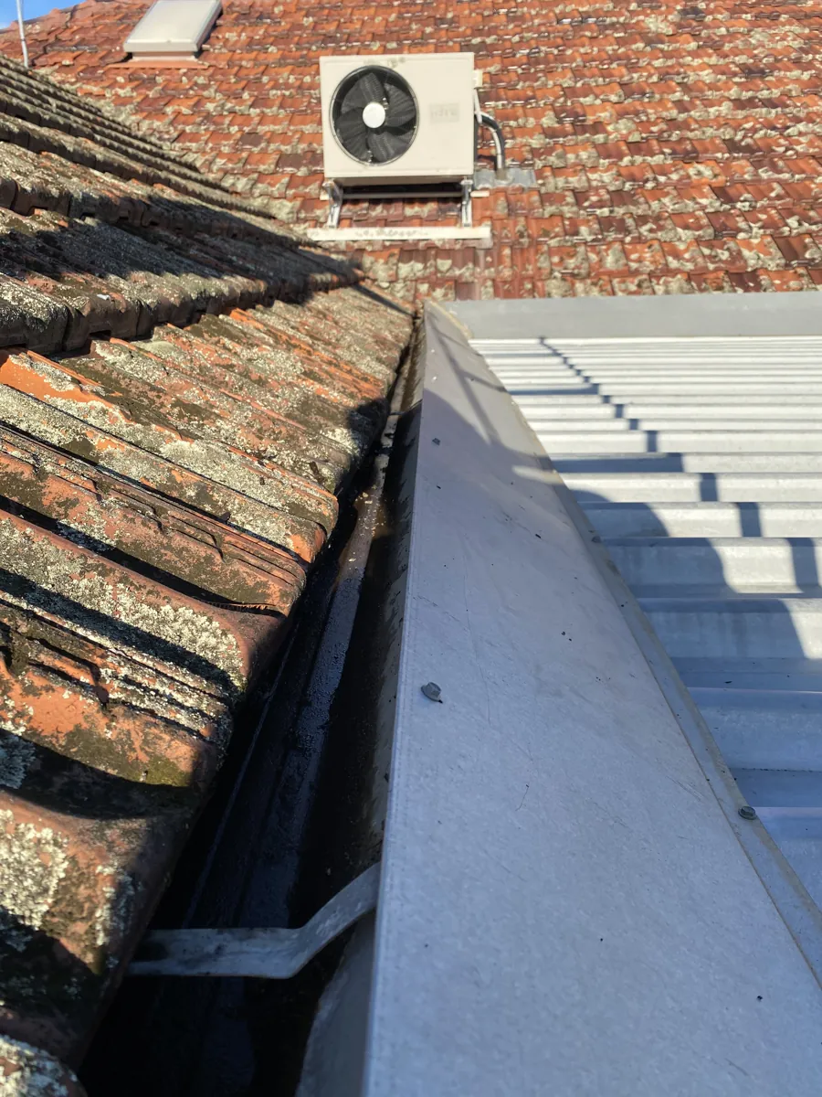 The same tile-roof valley cleared after ProFlo vacuum cleaning, Perth